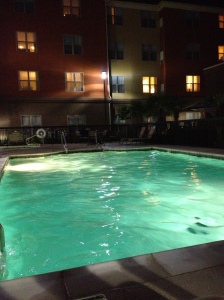 The Homewood Suites' swimming pool at night.